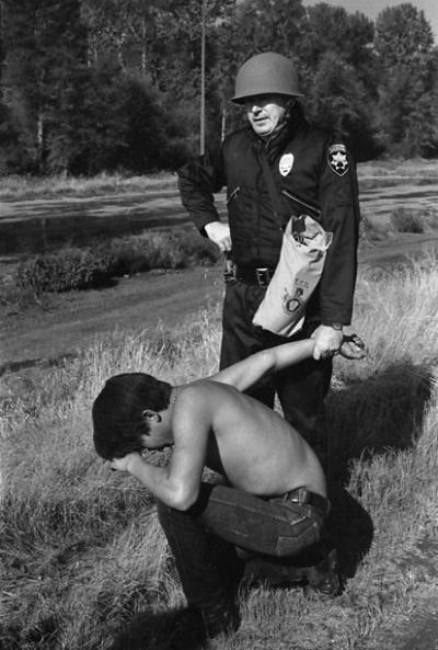 1970 Fishing Protest at Puyallup River, Tacoma. Police arrest a young tribal fisherman who appears to be suffering from exposure to tear gas. Photos courtesy of the S. Lehmer & D. Fear collections at The Puyallup Tribe Historic Preservation Department 1970 Fishing Protest at Puyallup River, Tacoma. Police arrest a young tribal fisherman who appears to be suffering from exposure to tear gas. Photos courtesy of the S. Lehmer & D. Fear collections at The Puyallup Tribe Historic Preservation Department