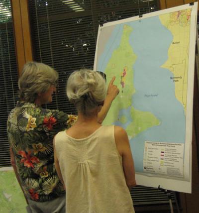 Islanders study the proposed zoning map presented during a zoning meeting for proposed zoning for recreational marijuana facilities on Vashon Island. Islanders study the proposed zoning map presented during a zoning meeting for proposed zoning for recreational marijuana facilities on Vashon Island.