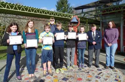  (Left to right) Julia Ellison, Cleo Hudson, Stuart Kraabel, Roy Bumgarner-Cmdr, Post 2826 (in back), Bjorn Lynge, Julian White-Davis, Stella Harrison, old John Croan, and THS English Teacher Kristen Spangler.