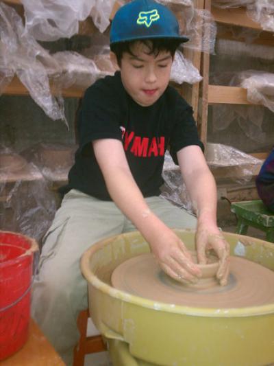 5th grader Lucca Shattuck at the pottery wheel 5th grader Lucca Shattuck at the pottery wheel