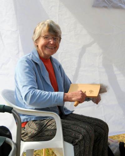 Lis Steffens, carding wool at the 2012 Vashon Sheepdog Classic.