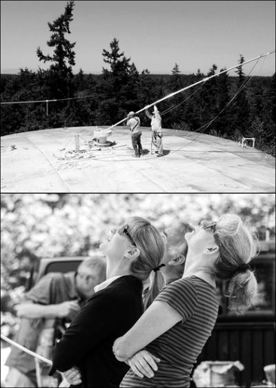 Dan Schueler and Rick Wallace install the KVSH antenna as ground crew members Melodie Woods and Susan McCabe monitor the progress. Photos by John DeGroen.